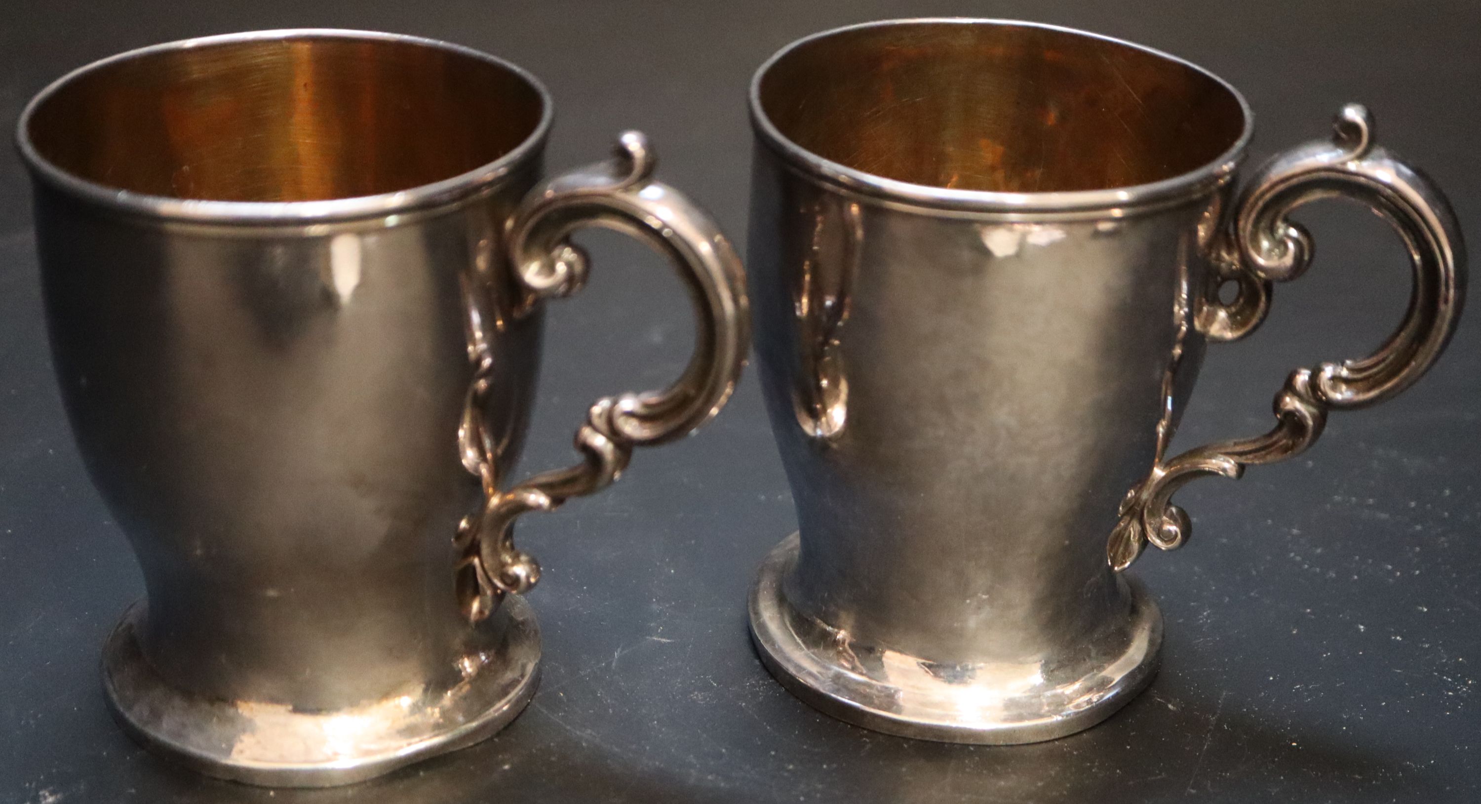 A pair of Victorian silver christening mugs, height 87mm, gross 8oz.